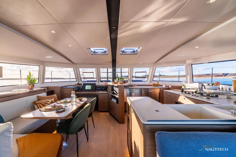 Slide: The Image of Luxurious interior of 2025 Nautitech 48 Open catamaran with modern dining and kitchen area. - 35