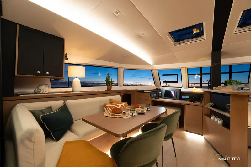 Slide: The Image of Luxurious interior of 2025 Nautitech 48 Open catamaran with modern furnishings and panoramic windows. - 36