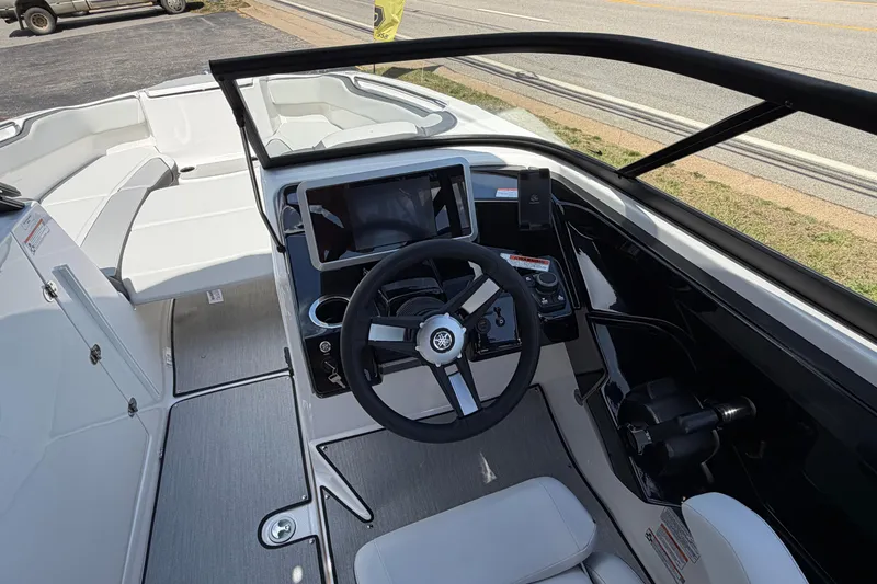Slide: The Image of 2026 Yamaha Boats AR250 cockpit with modern steering and navigation controls. - 13