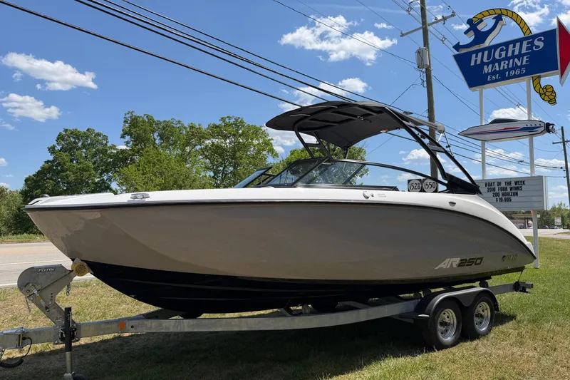 Slide: The Image of 2026 Yamaha Boats AR250 on trailer at Hughes Marine dealership. - 14