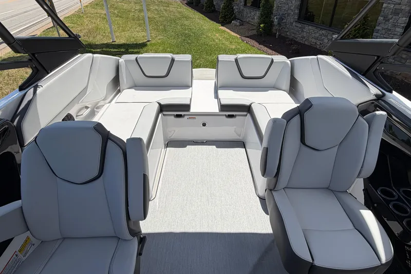 Slide: The Image of 2026 Yamaha Boats AR250 interior with sleek, modern seating and spacious layout. - 6