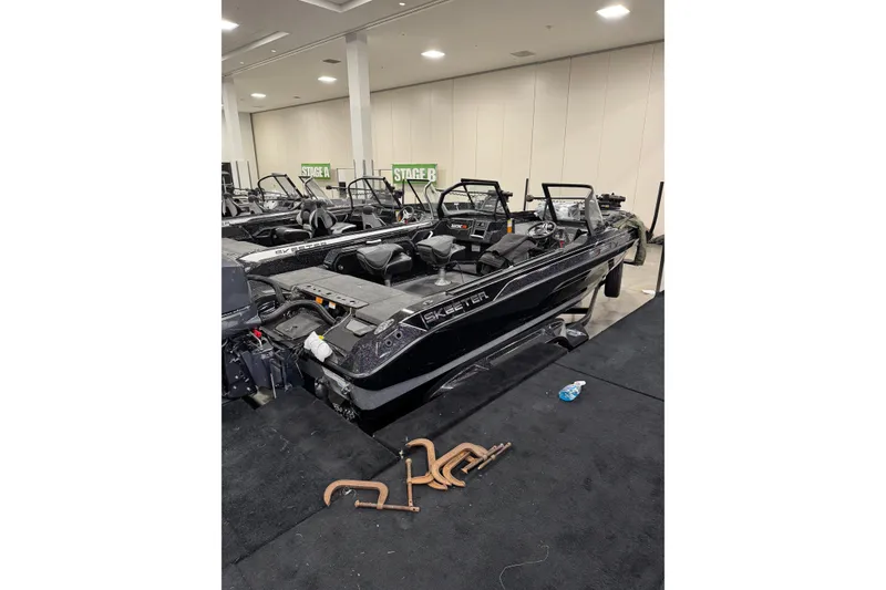 The Image of 2026 Skeeter WXR2060 F boat displayed indoors at an exhibition. - 0