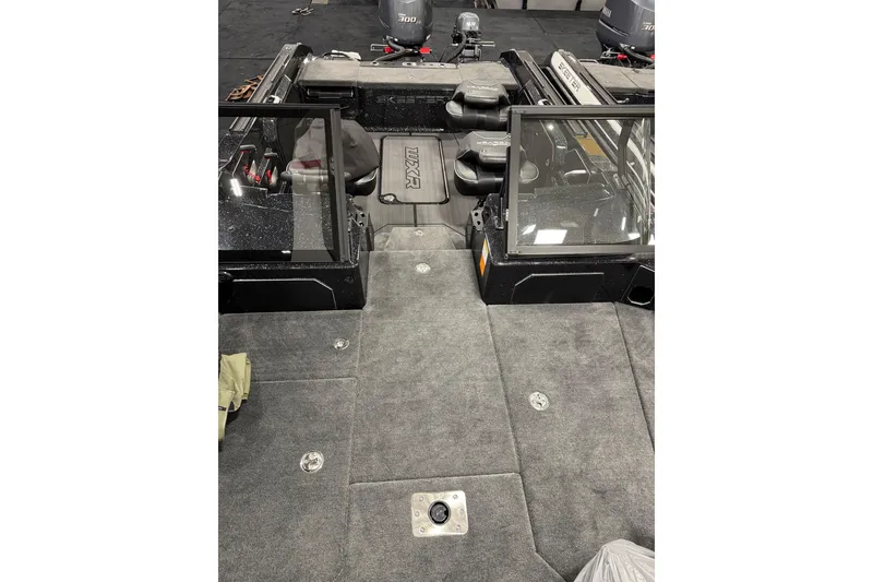Slide: The Image of 2026 Skeeter WXR2060 F boat interior with carpeted deck and seating area. - 12