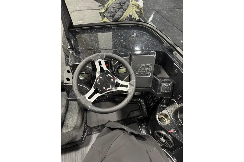 Slide: The Image of Steering console of 2026 Skeeter WXR2060 F boat with modern controls and sleek design. - 5