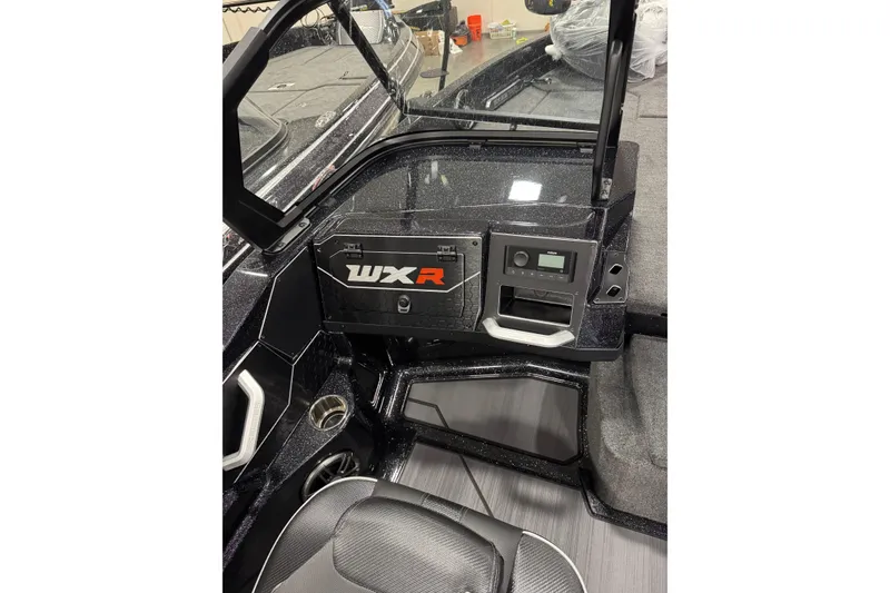 Slide: The Image of Interior of 2026 Skeeter WXR2060 F boat, featuring sleek dashboard and controls. - 6
