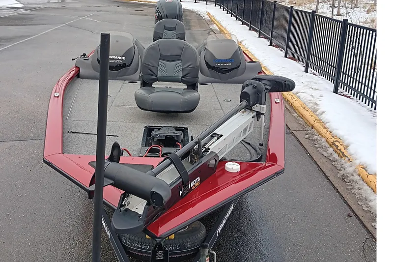 Slide: The Image of 2019 Tracker Pro Team 195 TXW Tournament Edition boat on snowy pavement. - 2