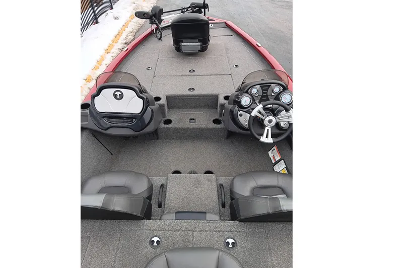 Slide: The Image of 2019 Tracker Pro Team 195 TXW Tournament Edition boat interior with steering console and seating. - 5