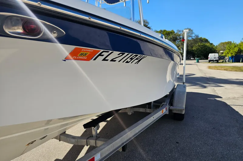 Slide: The Image of 2013 BlackJack 224 boat deck with seating and storage compartments. - 12