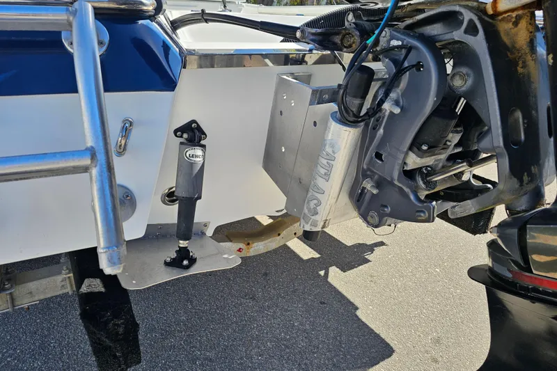 Slide: The Image of 2013 BlackJack 224 boat with Yamaha 250 engine on trailer, parked outdoors. - 8