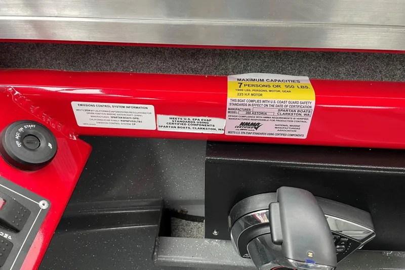 Slide: The Image of 2024 Spartan 200 Astoria boat capacity label, showing 7-person or 950 lbs limit. - 11