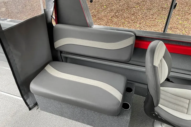 Slide: The Image of 2024 Spartan 200 Astoria interior seating with gray and beige upholstery. - 13