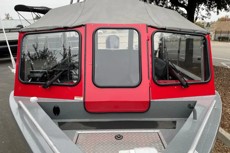 Slide: The Image of 2024 Spartan 200 Astoria boat with red cabin and gray exterior. - 4