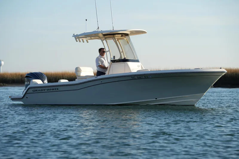 Slide: The Image of 2023 Grady-White Fisherman 216 boat on calm water, side view. - 1
