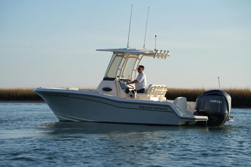 Slide: The Image of 2023 Grady-White Fisherman 216 boat cruising on calm water. - 10