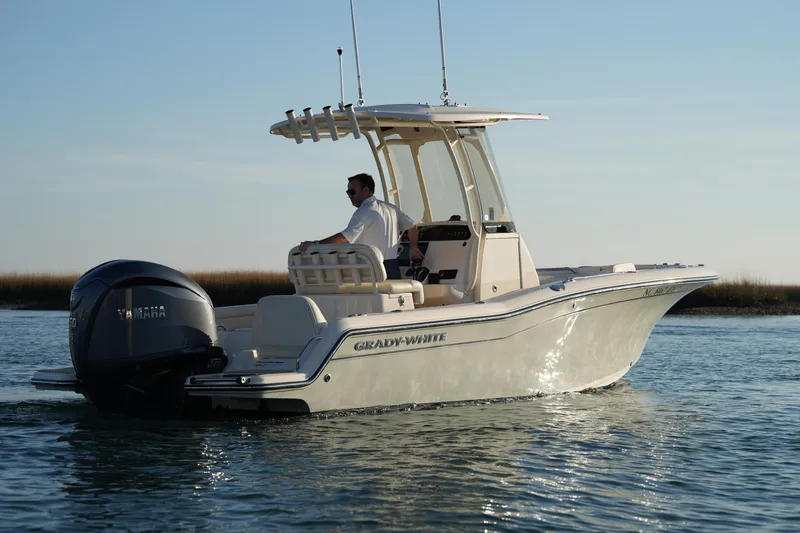 Slide: The Image of 2023 Grady-White Fisherman 216 boat cruising on calm water. - 14