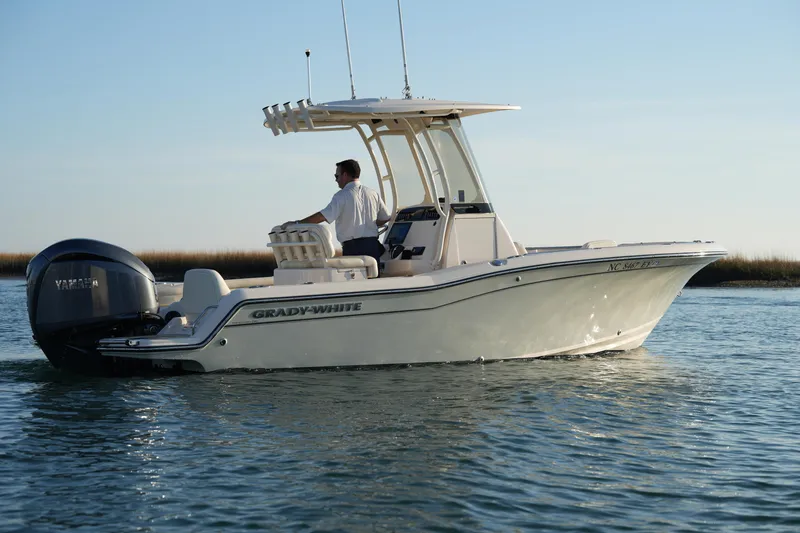 Slide: The Image of 2023 Grady-White Fisherman 216 boat cruising on calm water. - 15