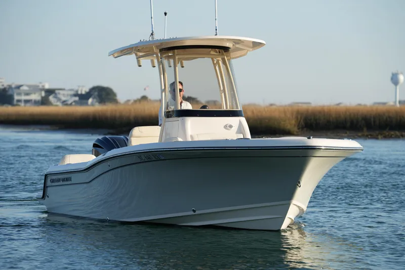 Slide: The Image of 2023 Grady-White Fisherman 216 boat cruising on calm water. - 16