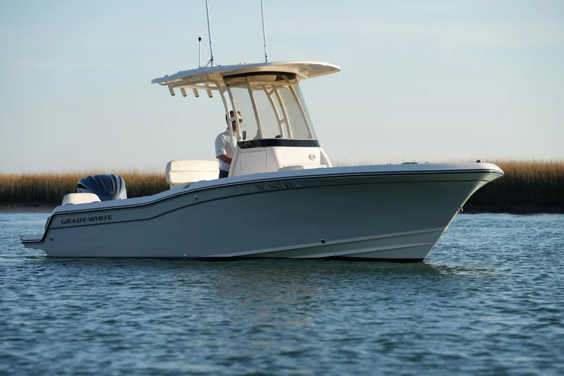 Slide: The Image of 2023 Grady-White Fisherman 216 boat on calm water, side view. - 2