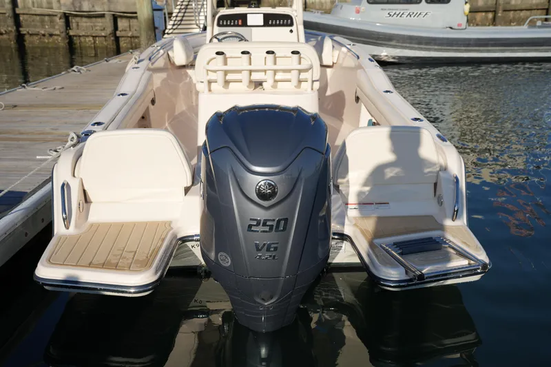 Slide: The Image of 2023 Grady-White Fisherman 216 boat with powerful V6 engine docked at marina. - 22