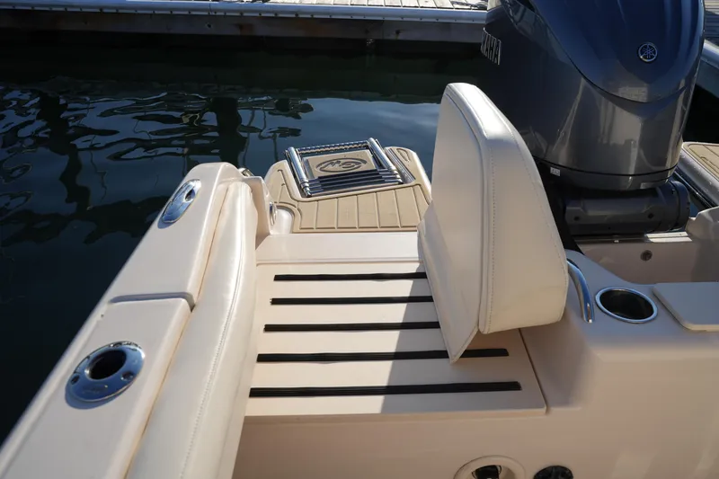 Slide: The Image of 2023 Grady-White Fisherman 216 boat interior with seating and motor detail. - 24