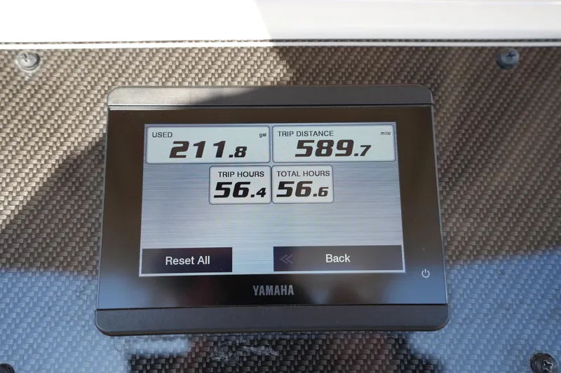 Slide: The Image of Yamaha display on 2023 Grady-White Fisherman 216 showing fuel, distance, and hours. - 32