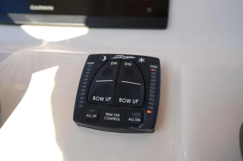 Slide: The Image of Trim tab control panel on 2023 Grady-White Fisherman 216 boat. - 36