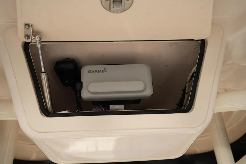 Slide: The Image of 2023 Grady-White Fisherman 216 boat compartment with Garmin device inside. - 38