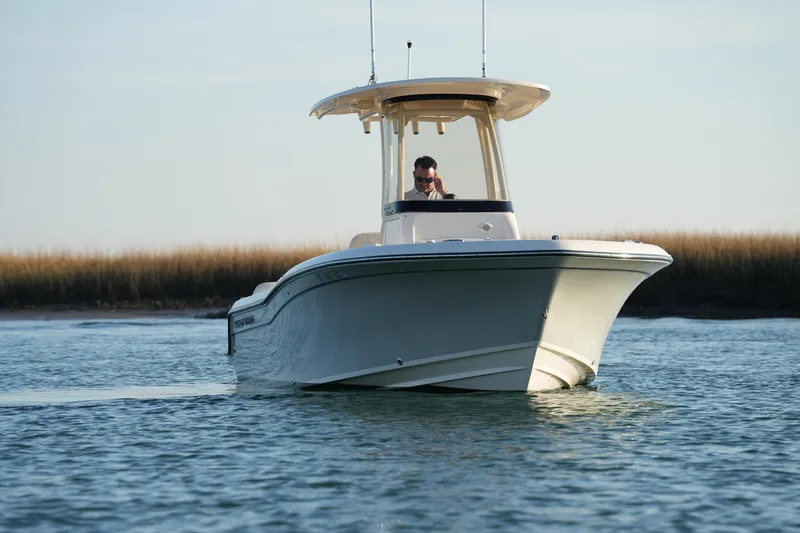 Slide: The Image of 2023 Grady-White Fisherman 216 boat cruising on calm water. - 4