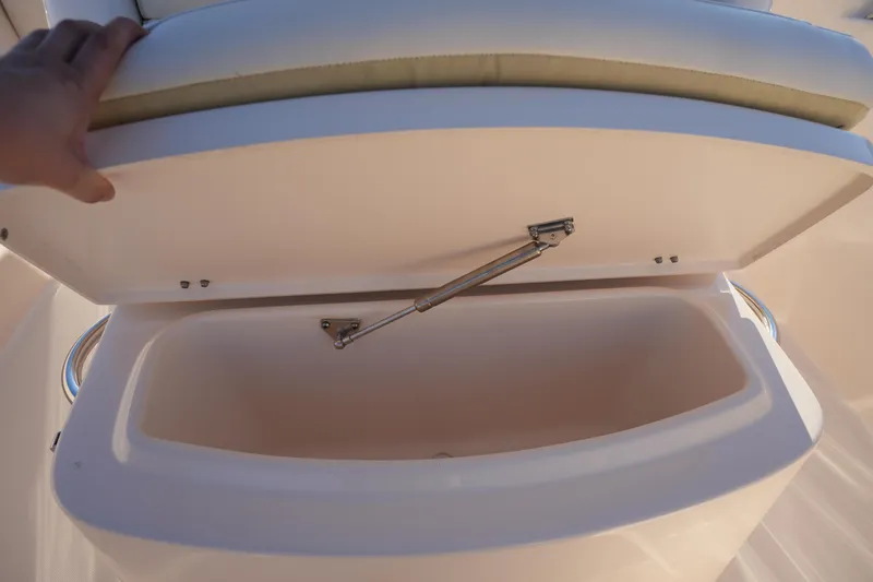 Slide: The Image of 2023 Grady-White Fisherman 216 boat storage compartment with open lid. - 42