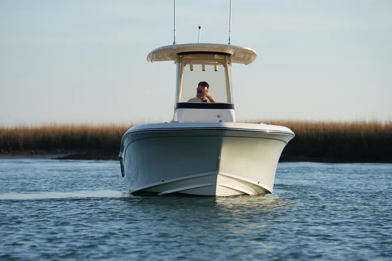 Slide: The Image of 2023 Grady-White Fisherman 216 boat on calm water, front view. - 5