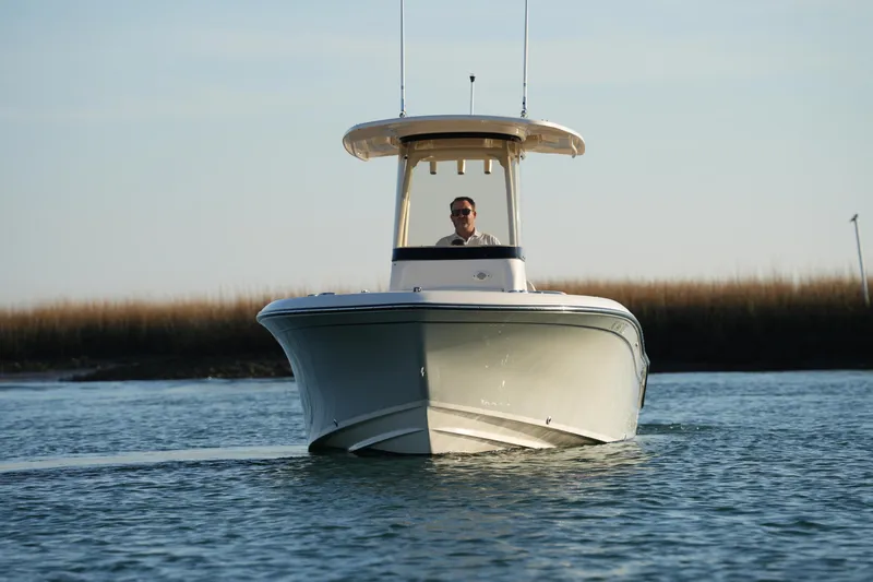 Slide: The Image of 2023 Grady-White Fisherman 216 boat cruising on calm water. - 6