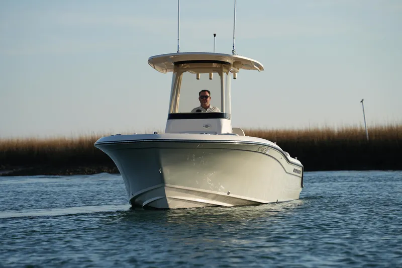 Slide: The Image of 2023 Grady-White Fisherman 216 boat cruising on calm water. - 7