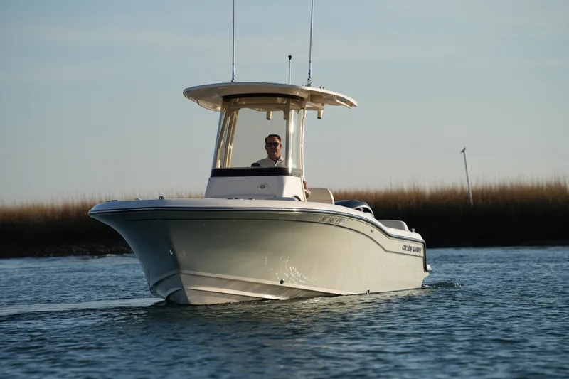 Slide: The Image of 2023 Grady-White Fisherman 216 boat cruising on calm water. - 8
