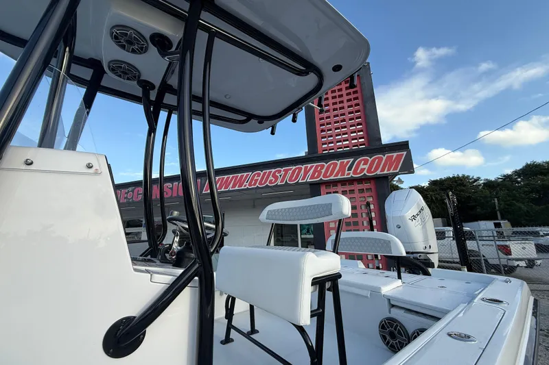 Slide: The Image of 2026 Contender 26 Bay boat interior with white seating and modern design. - 16