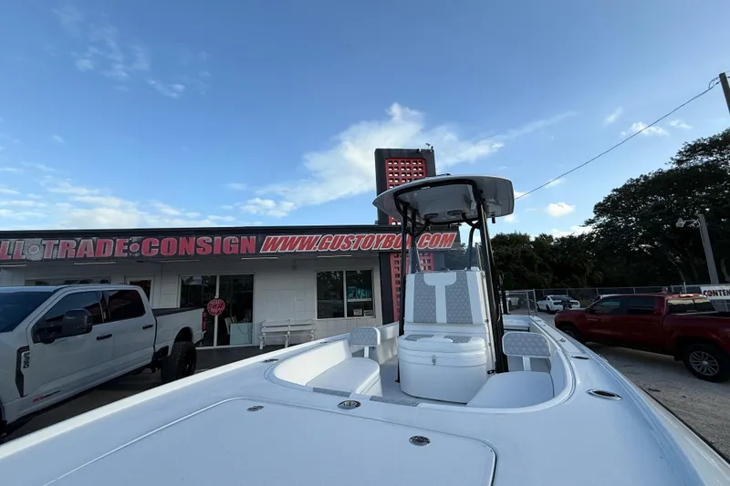 Slide: The Image of 2026 Contender 26 Bay boat with dual seats and powerful outboard motor. - 18