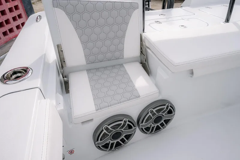 Slide: The Image of 2026 Contender 26 Bay boat seat with hexagonal pattern and dual speakers. - 24