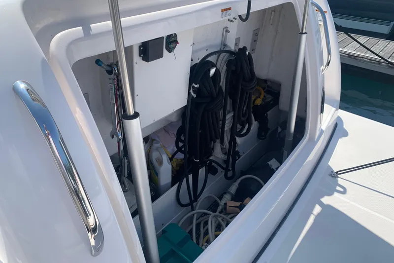 Slide: The Image of Storage compartment of a 2005 Tiara Yachts 3600 Sovran, featuring ropes and equipment. - 13