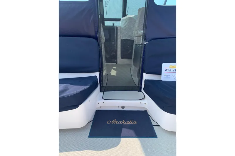 Slide: The Image of 2005 Tiara Yachts 3600 Sovran interior with navy seating and personalized mat. - 15