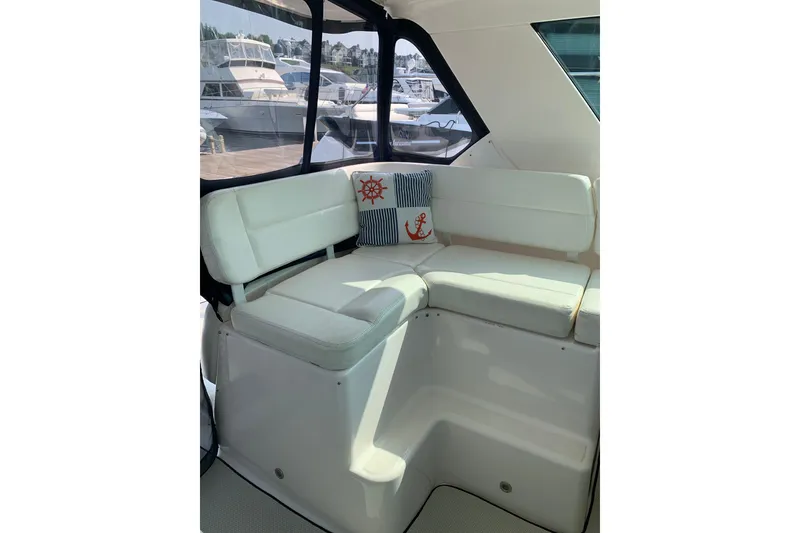 Slide: The Image of 2005 Tiara Yachts 3600 Sovran interior seating with nautical-themed cushions. - 22