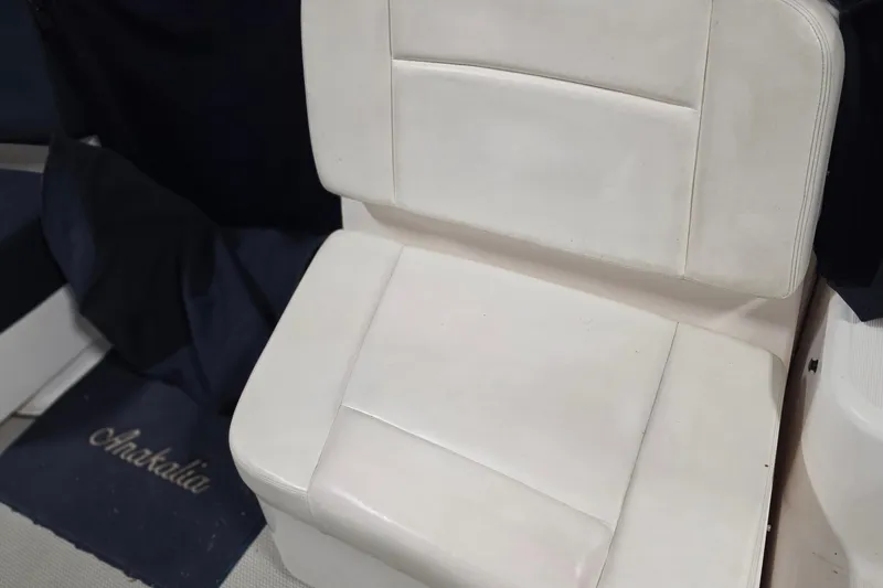 Slide: The Image of White seating on a 2005 Tiara Yachts 3600 Sovran boat interior. - 23