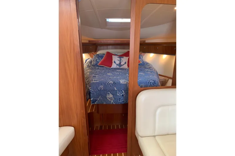 Slide: The Image of 2005 Tiara Yachts 3600 Sovran cabin with cozy bed and nautical decor. - 30