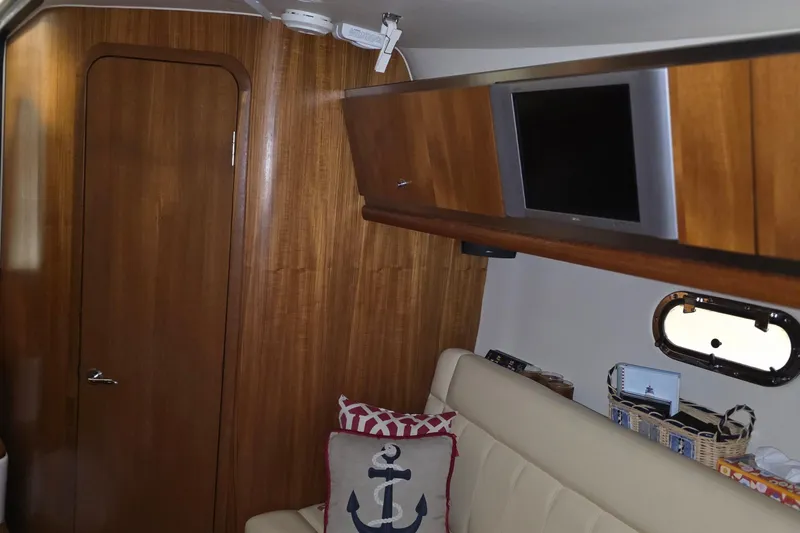Slide: The Image of Interior of 2005 Tiara Yachts 3600 Sovran with wood paneling and nautical decor. - 35