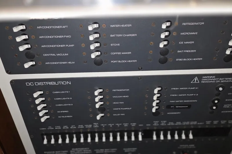 Slide: The Image of Control panel of a 2005 Tiara Yachts 3600 Sovran, featuring various switches and labels. - 36