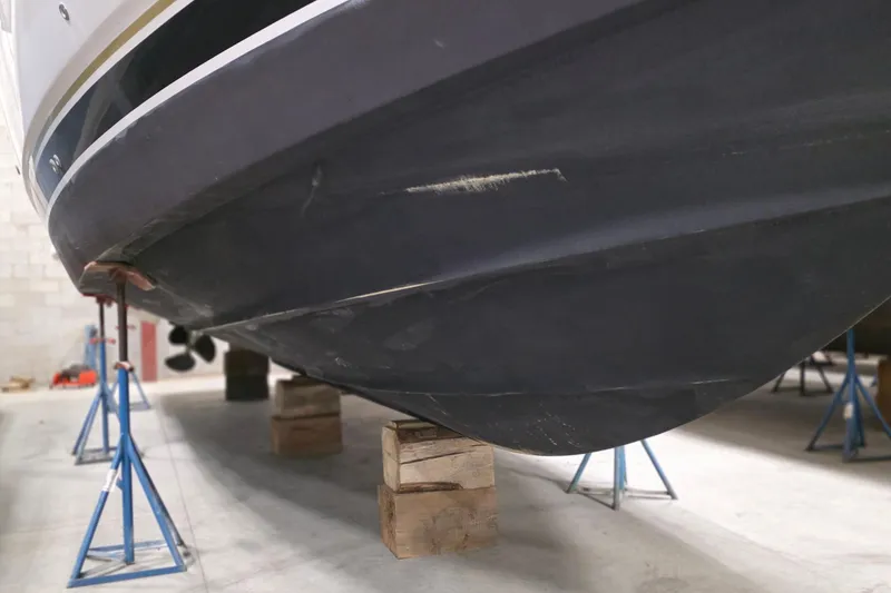 Slide: The Image of 2005 Tiara Yachts 3600 Sovran hull on stands in a storage facility. - 43