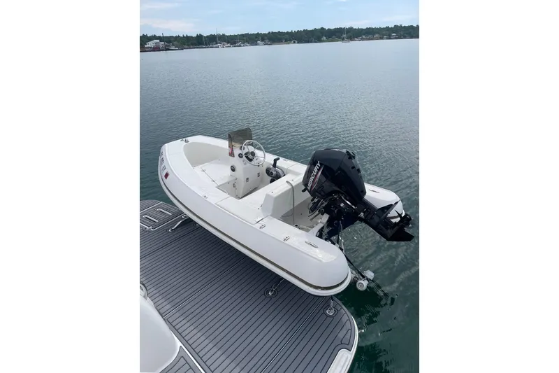 Slide: The Image of 2005 Tiara Yachts 3600 Sovran with Mercury outboard motor on calm water. - 56