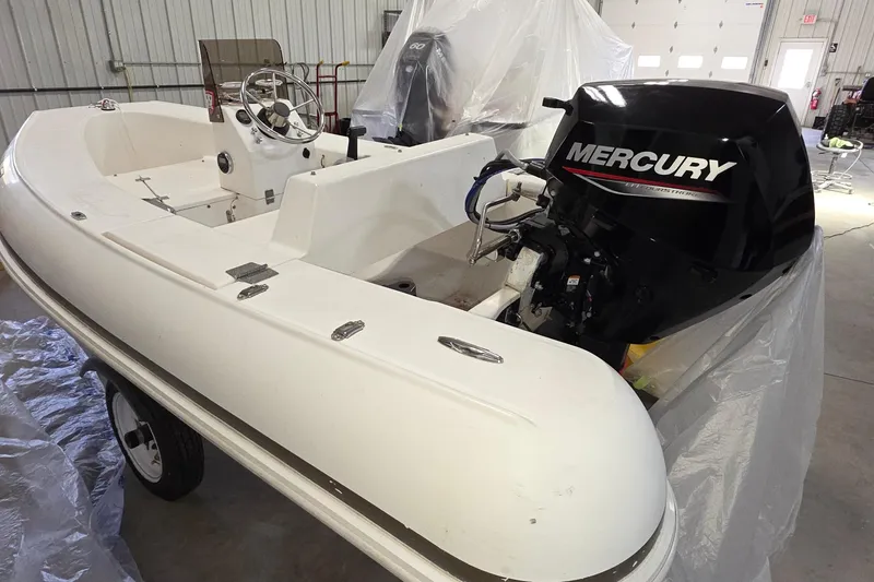 Slide: The Image of 2005 Tiara Yachts 3600 Sovran with Mercury outboard engine in a garage setting. - 58