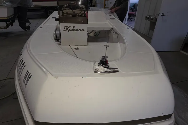 Slide: The Image of 2005 Tiara Yachts 3600 Sovran boat interior with steering console in a garage. - 63