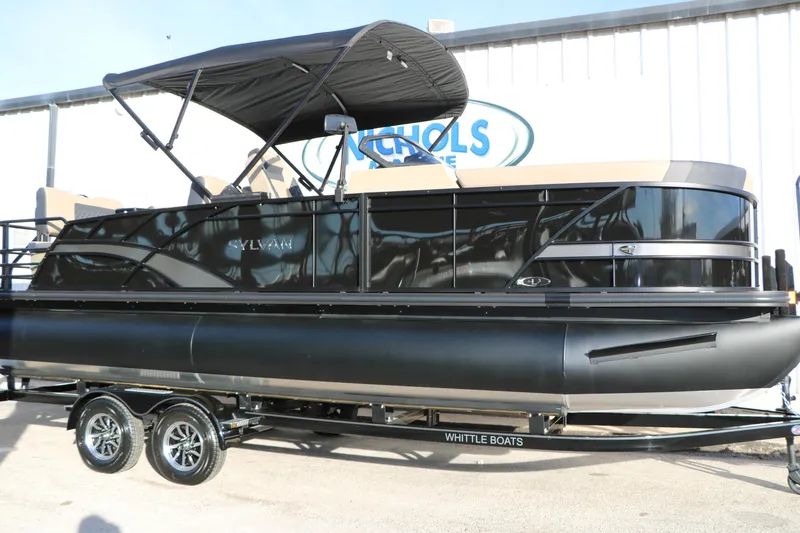 Slide: The Image of 2026 Sylvan L3 DLZ pontoon boat with black canopy on trailer. - 10