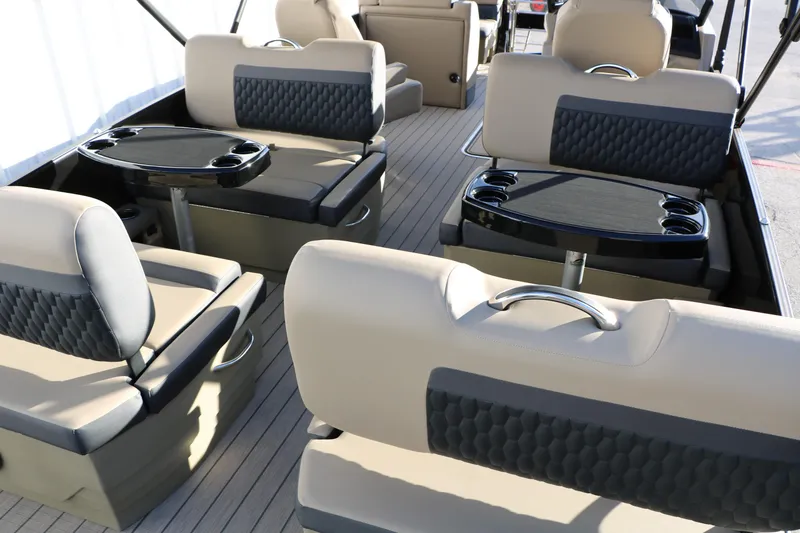 Slide: The Image of Luxurious interior of 2026 Sylvan L3 DLZ pontoon boat with plush seating and tables. - 17