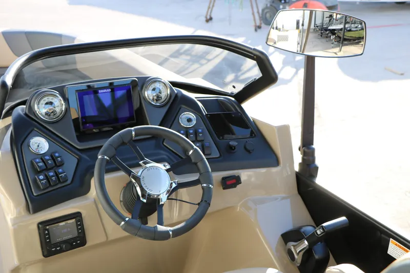 Slide: The Image of 2026 Sylvan L3 DLZ boat dashboard with steering wheel and control panel. - 21